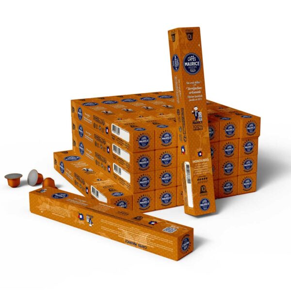 Boîte de capsules de café La Esperanza Honduras Montecillos 100 % arabica de la marque Cafés Maurice torréfacteur Toulon Sanary 83, couleur orange, compatibles avec les machines Nespresso®. Trois capsules sont disposées à côté de la boîte, dont deux avec leur opercule visible.